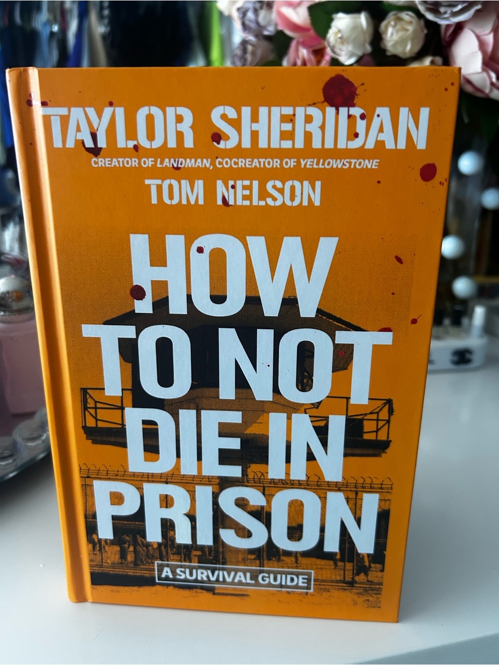 How to Not Die in Prison by Taylor Sheridan & Tom Nelson - Orange Cover